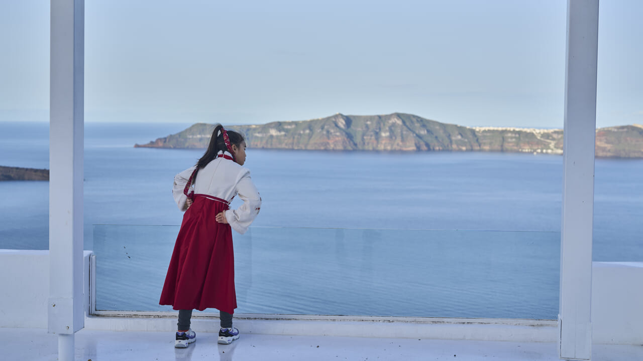What is going on in Santorini, and what risk runs the island?