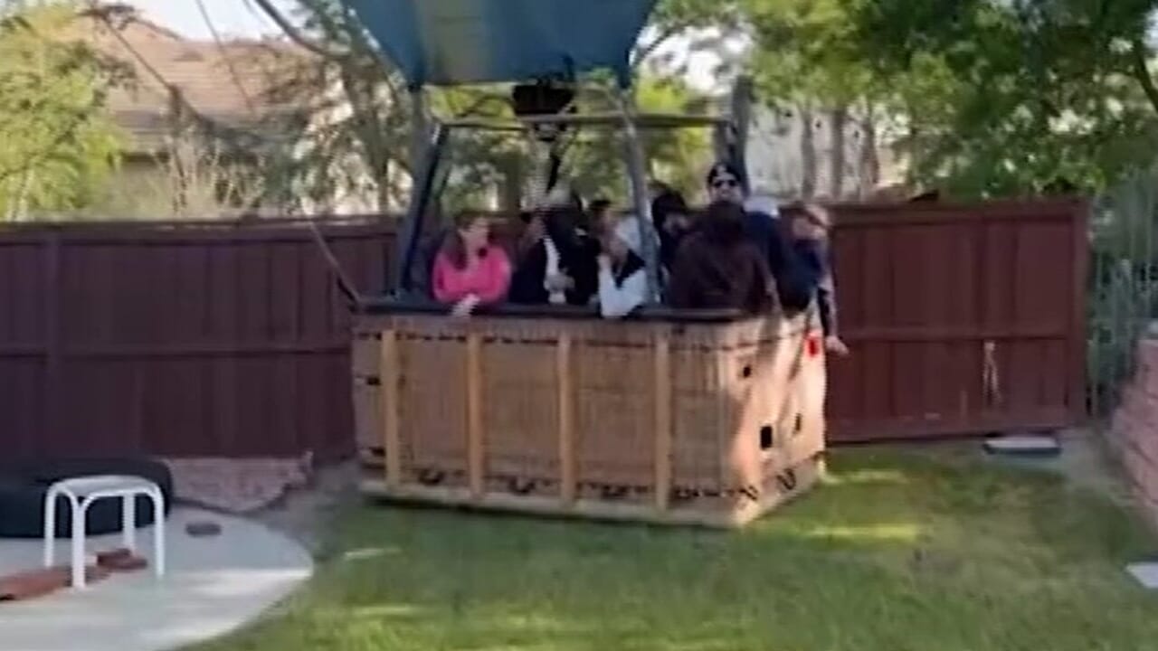 They wake up to find a hot air balloon and 13 people in the garden
