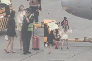 They miss the plane and run onto the apron with the trolley to stop it