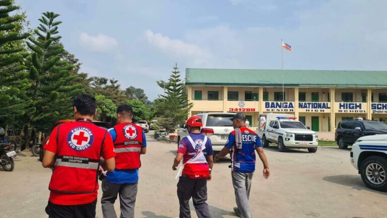 He enters the school and kills two students: he had told his friends to go home